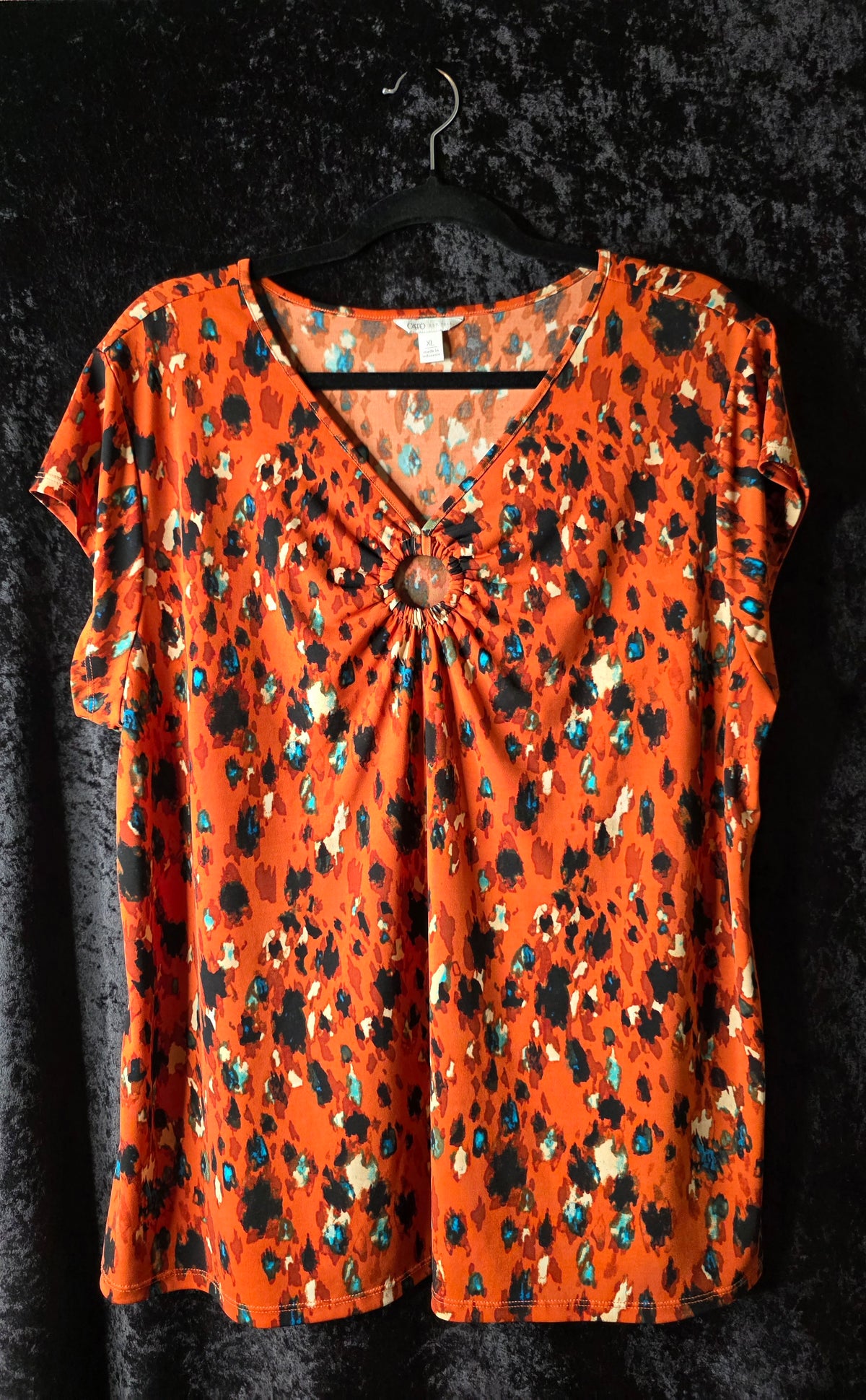 Bold Orange Abstract Print Ring-Detail Top